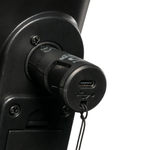 Black XLR USB-C charger plugged into a mobility device port, showing the USB-C socket and tethered cap