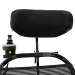 Jazzy Ultra Light attendant joystick control and black headrest mounted behind the wheelchair backrest